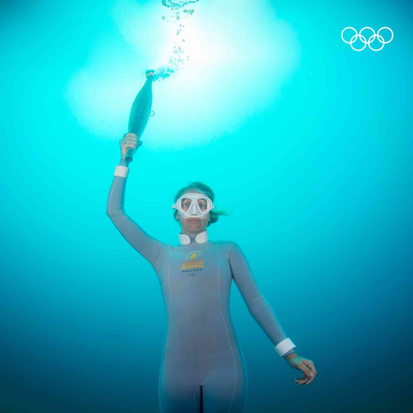 Diver retrieves torch from Mediterranean depths to open Paris Olympics 2024