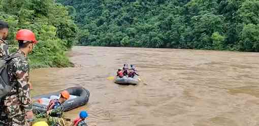 Search for dozens missing after landslide sweeps buses into Nepal river is suspended