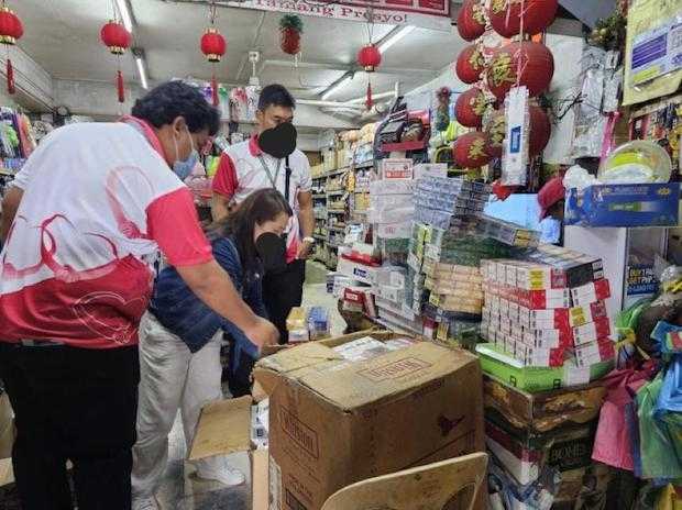 BIR team raids supermarket in Valenzuela City after selling fake, smuggled cigarettes