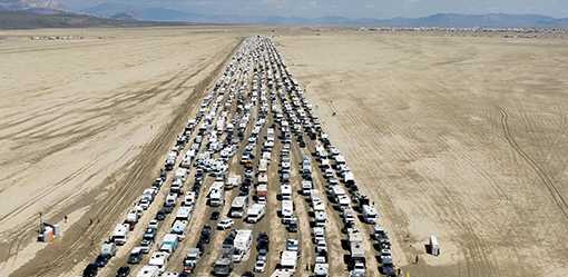 Burning Man festival road reopens, allowing thousands to escape muddy trap