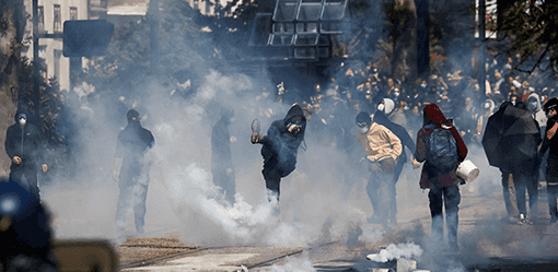 French police clash with black-clad anarchists during May Day rallies