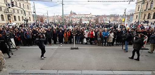 Mourners march, hold mass hug to remember Prague shooting victims