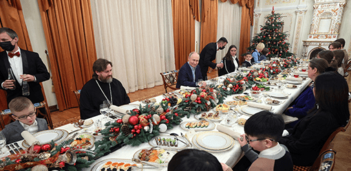 On Orthodox Christmas Putin vows to back soldiers who 'defend' Russia