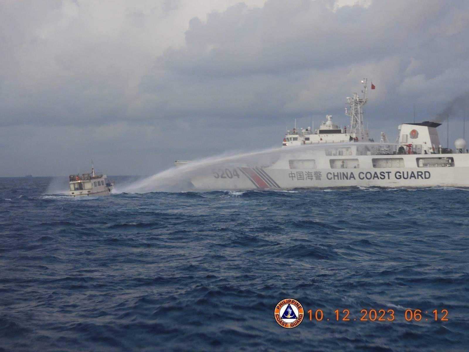 Philippines says China rammed, water cannoned resupply vessels