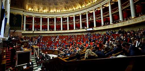 Tougher French immigration bill passes, Macron's parliament majority wobbles