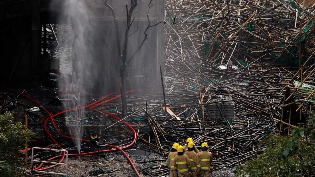 Hong Kong arrests 13 for apartment tower fire, blames use of renovation material