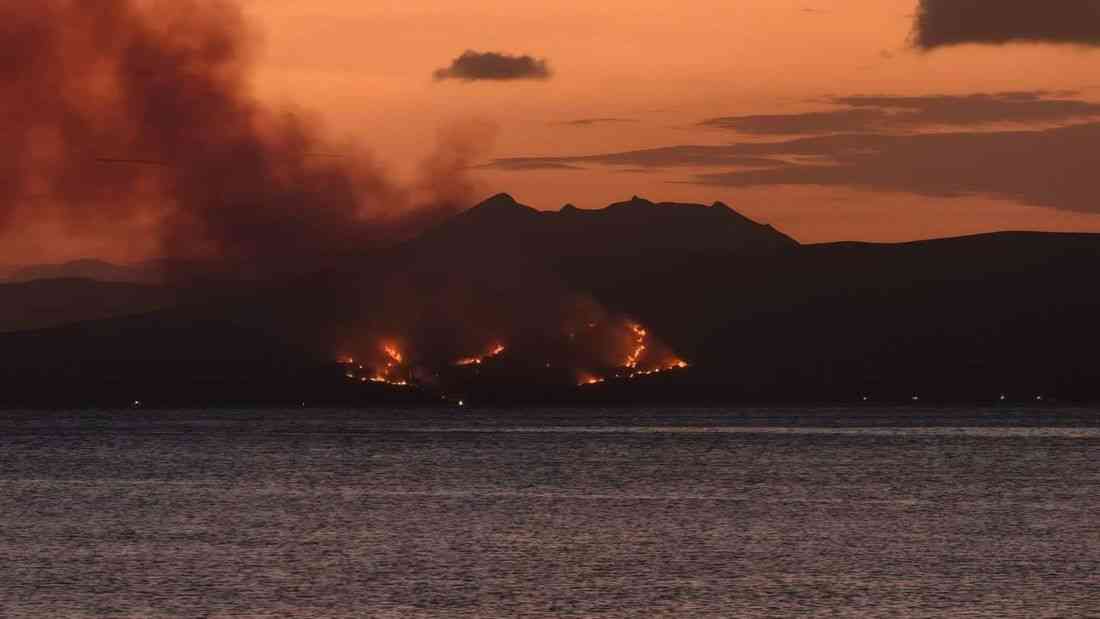 Grass fire erupts over the slopes of Taal Volcano Island