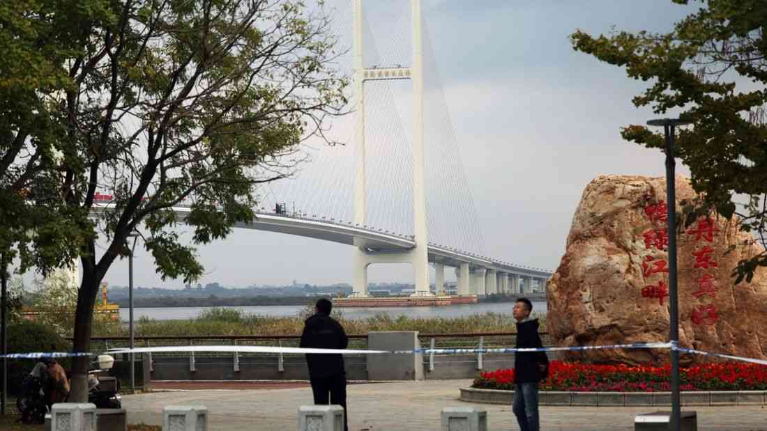 Trucks line up as long-delayed China-North Korea bridge officially opens