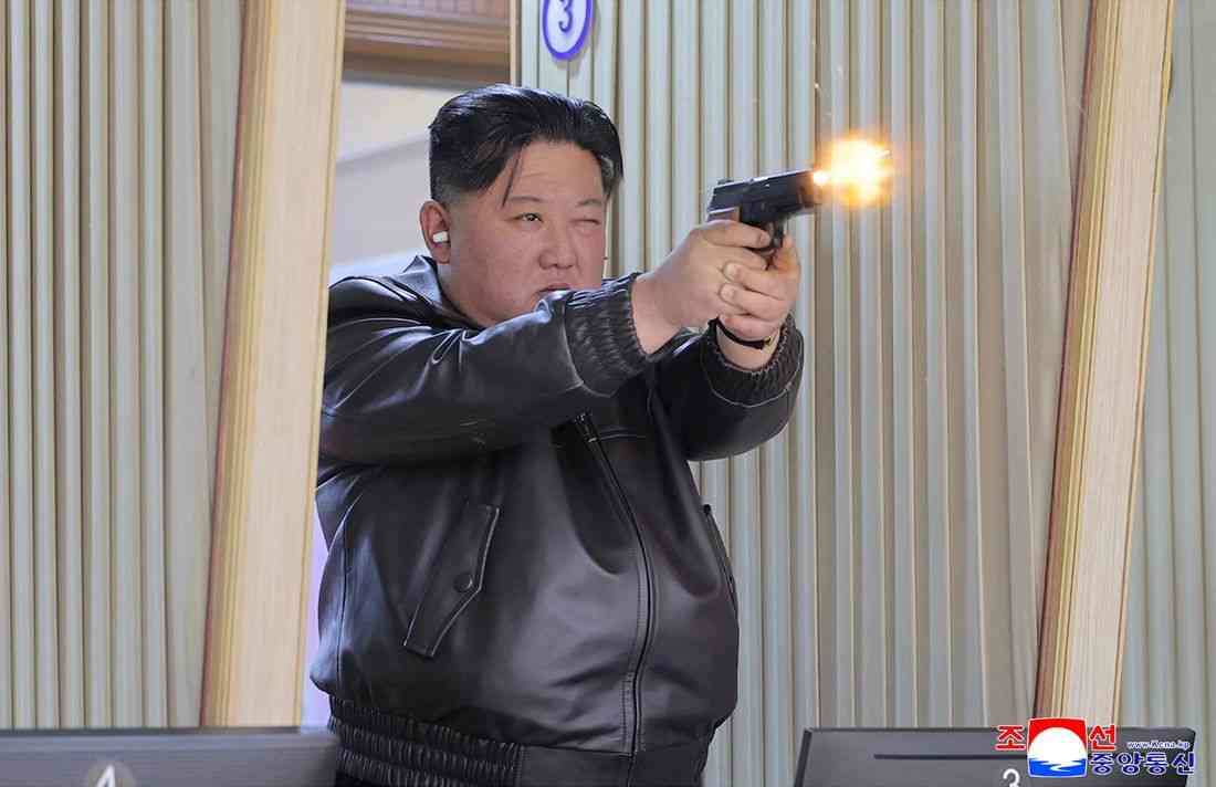 North Korean leader Kim test fires handguns during visit to munitions factory, KCNA reports