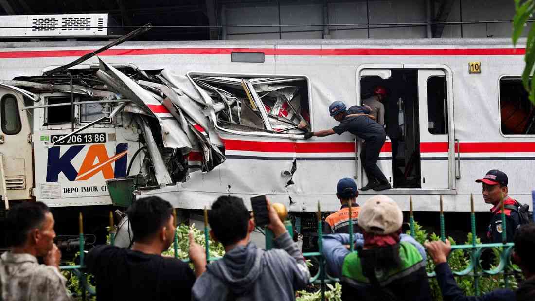 Indonesia train crash toll rises to 14 as rescuers work to remove trapped passengers