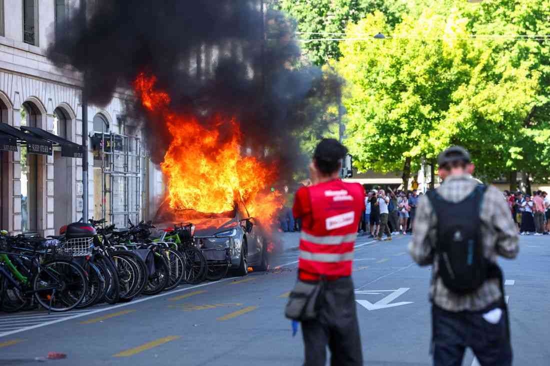 Protesters set Tesla ablaze, smash UN office's windows in Geneva anti-G7 march