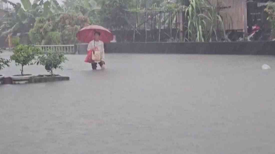 Torrential rain from passing storm shuts down parts of Taiwan and Japan