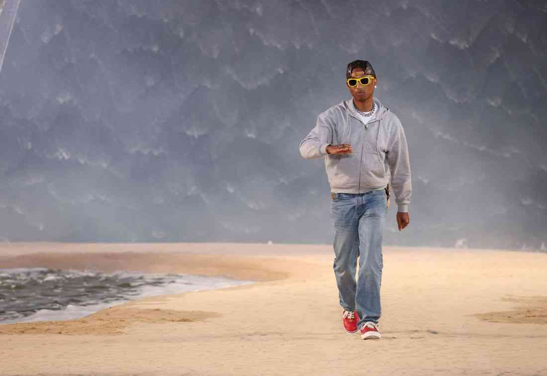 Louis Vuitton designer Pharrell Williams borrows from California surf culture as heatwave hits Paris