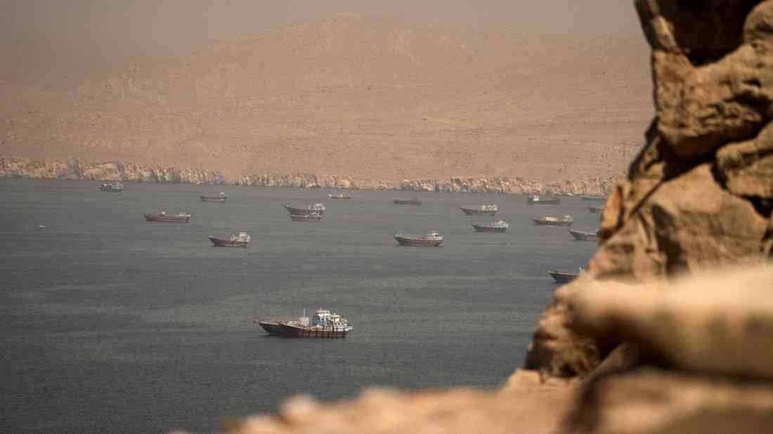 Oil settles lower, but remains near one-month high on U.S.-Iran tension