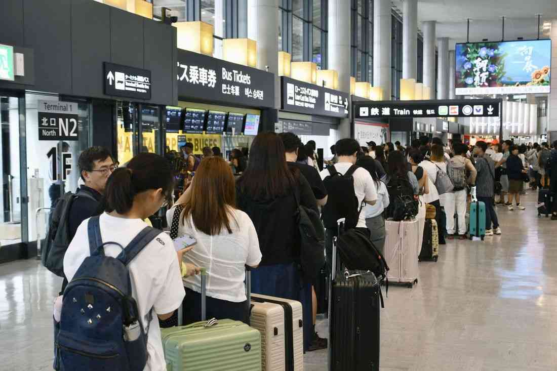 Thousands stranded at Japan's Narita airport after record rain kills four
