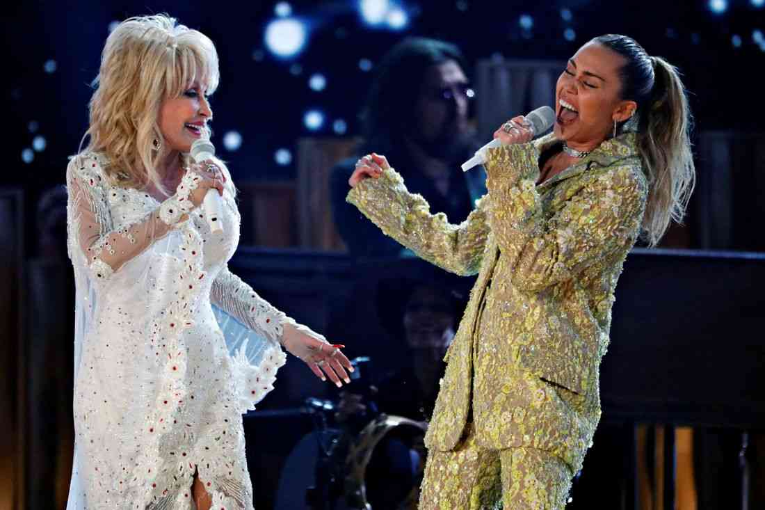 Miley Cyrus pays tribute to godmother Dolly Parton after singer's death at 80