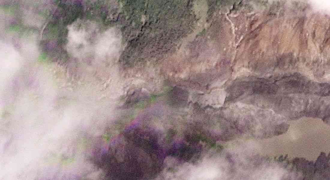 Lake formed by landslide on Nepal-Tibet border overflows, halting rescue work