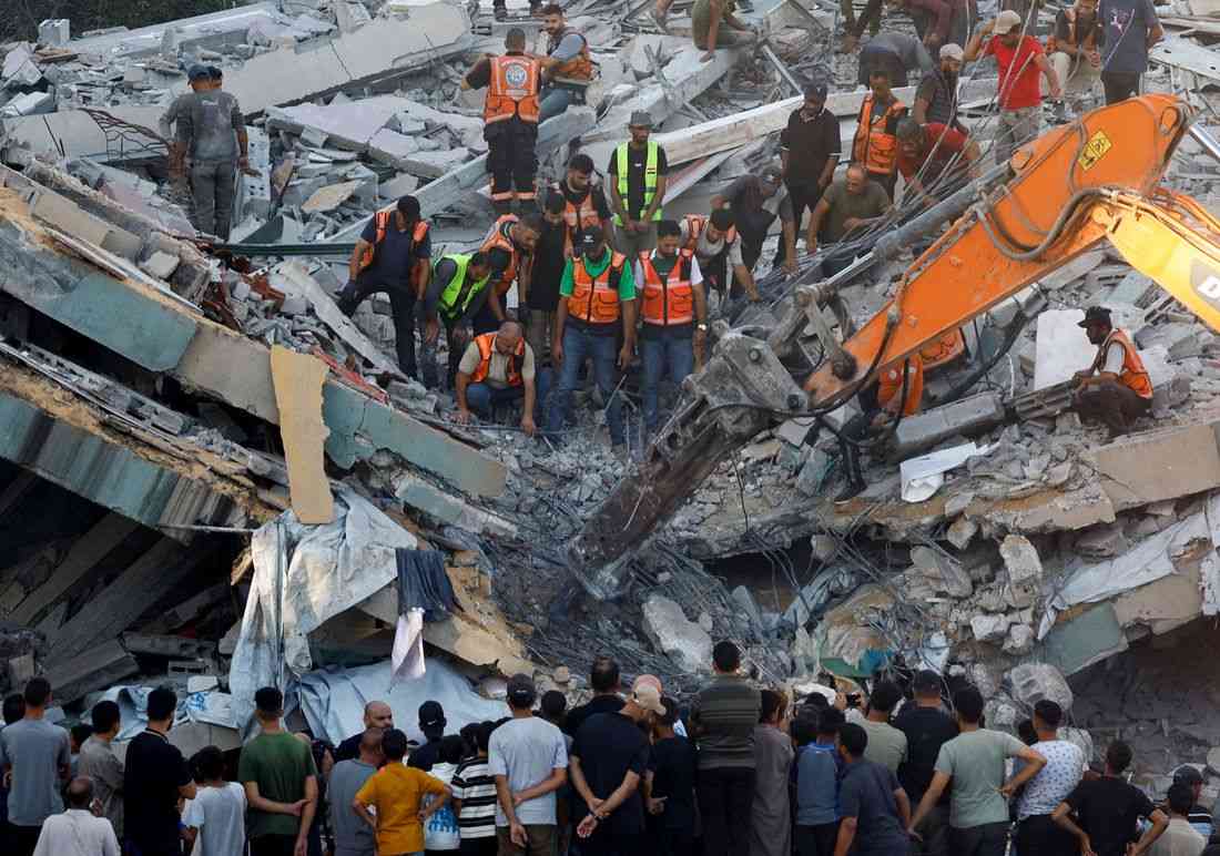 War-damaged Gaza building collapses killing 12 people seeking shelter inside