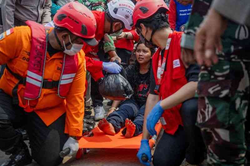 Rough weather hinders third-day search for 129 missing after ferry capsizes in Indonesia