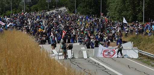 A dozen French police wounded in clashes with protesters opposing rail link in Alps