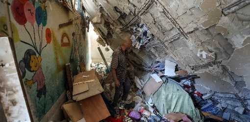 As Israel hammers north Gaza, Palestinians dig for the dead in multi-storey ruins
