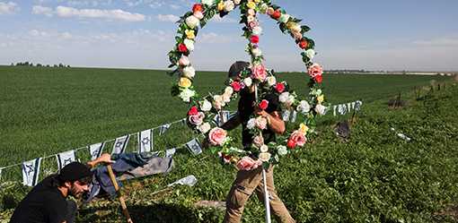 Bereaved family members plant trees in Israeli memorial for festival dead