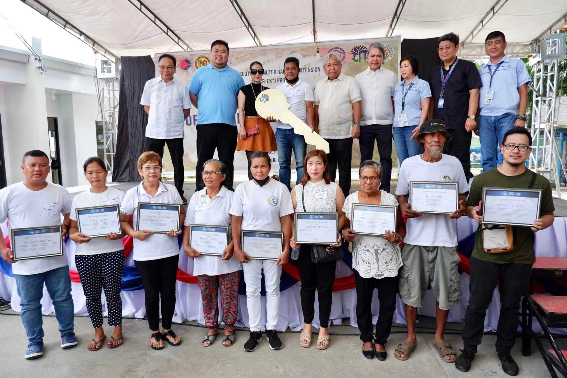 DOTr turns over 50 social housing units to families affected by NSCR construction