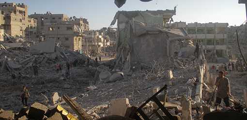 Israeli strikes kill 15 Palestinians in Gaza school, nine West Bank militants