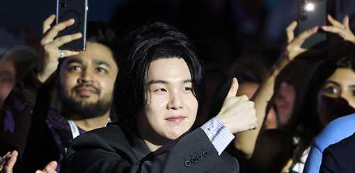 K-pop star Suga begins process to serve military duty