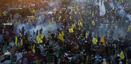 Pakistanis protesting Hezbollah leader's killing clash with Karachi police