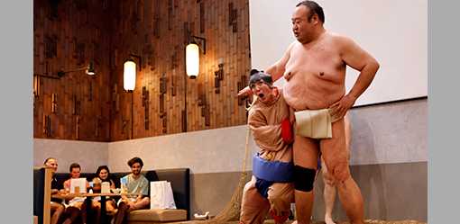 Sumo retirees play for laughs from tourists flooding back to Japan