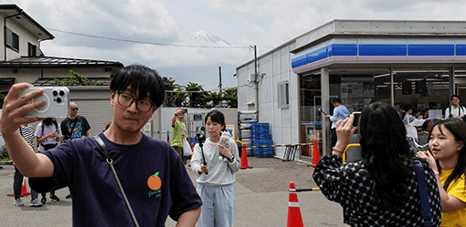 Swarmed with tourists, Japan town blocks off viral view of Mt. Fuji