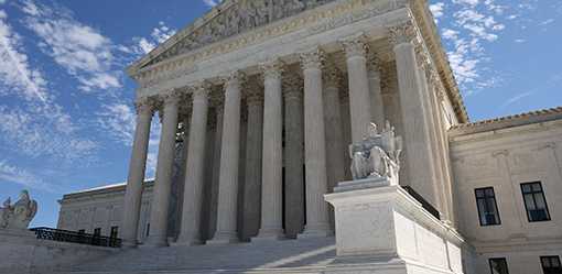 Under fire, US Supreme Court unveils ethics code for justices