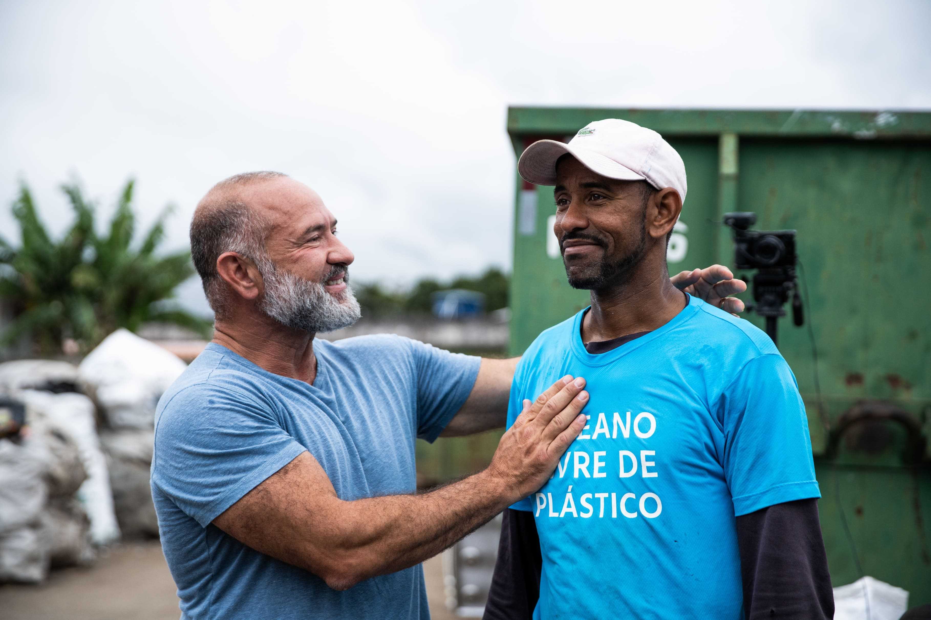 What can hand-gathering 100M kilograms of discarded plastic achieve?